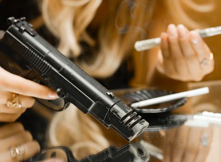 Addict conceprt - money, gun and drugs on mirror for your designの写真素材