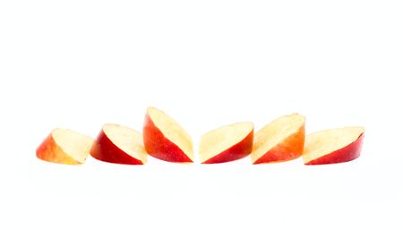 Apple slices isolated on whiteの写真素材