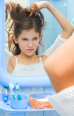 Teen girl smiling in bathroomの写真素材