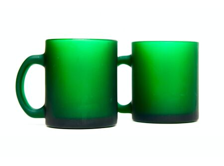Green cups isolated on whiteの写真素材