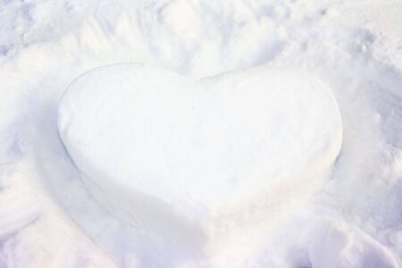 Beautiful white Heart from snowの写真素材