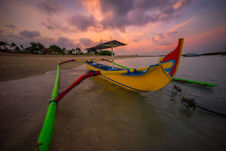 Bali boat at Kuta beach in the morning, Indonesiaの写真素材