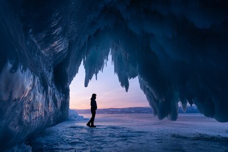 Ice cave in Baikal frozen lake in winter season, Siberia, Russai, Asiaの写真素材
