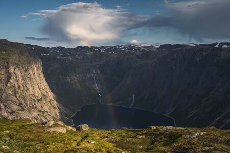 Rainbow above fjord in Trolltunga hiking trail, Odda, west Norway, Scandinavia, Europeの写真素材