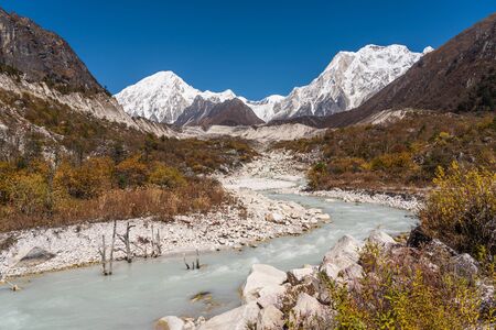 Himalaya mountains and stream water from melted glacier view from Bimthang village in Manaslu circuit trekking route in Nepal, Asiaの写真素材