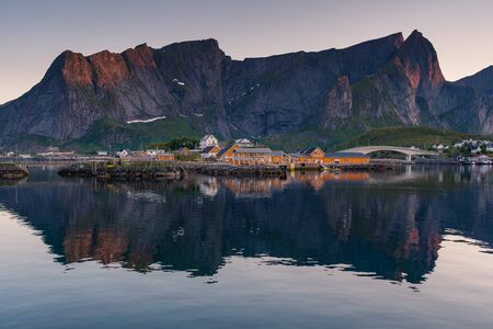 Sakrisoy village in summer season in midnight with reflection, Lofoten island in Nordland, Norway, Scandinavia, Europeの写真素材