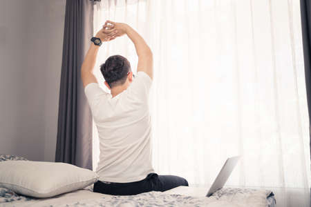 Close up hands of Asian business man using laptop computer working from home sitting on sofa, new normal  digital lifestyle, work from home concept. Bangkok Thailandの写真素材
