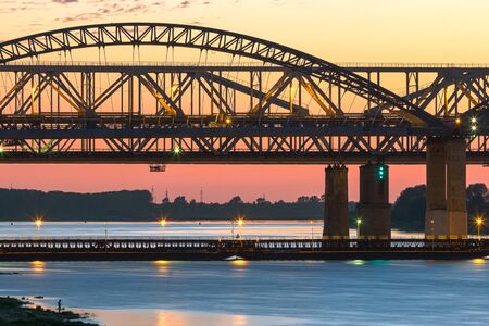 Spring evening in Nizhny Novgorod. Borsky bridge through Volga in the light of a declineの写真素材