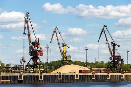 Port cranes on the bank of Volga River near the Bor town of Nizhny Novgorod regionの写真素材