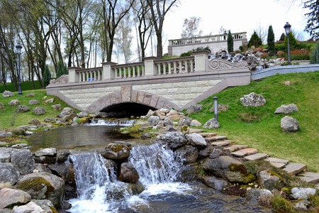 Artificial falls in city park in the early springの写真素材