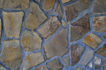 Fragment of a wall with sandstone stone