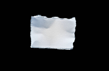 Picture of scrap of white paper on black backgroundの写真素材