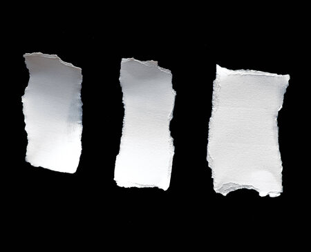 Picture of scrap of white paper on black backgroundの写真素材