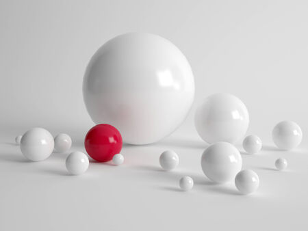 Diversity and uniqueness concept with multiple different sized white balls and one single red ball on a grey backgroundの写真素材