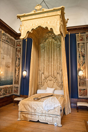 Baroque bed at state bedchamber at Hampton Court Palace near Londn
