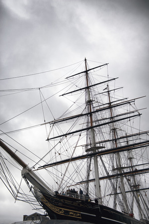 Masts and bowsprit of the Cutty Sark docked in Greenwich London as a museum exhibit of an old three masted Victorian merchant clipperのeditorial素材