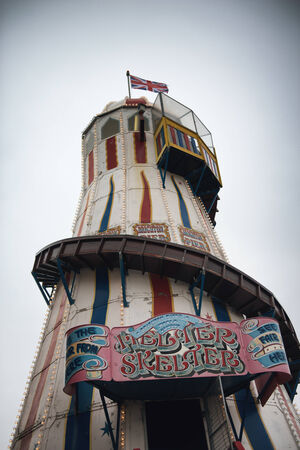 Low Angle View of Helter Skelter Amusement Ride with Cloudy Skies on Brighton Pier, Brighton, Englandのeditorial素材