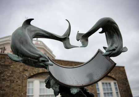Dolphin Sundial Under Cloudy Skies at Greenwich Royal Observatory, Englandのeditorial素材