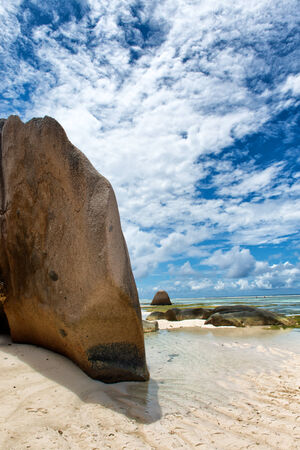 Giant Granite Rocks at Anse Source d'Argent Lagoon in La Digue Island, Seychelles. Captured on Blue and White Clouds Above.の写真素材