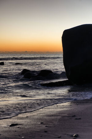 Close up Tranquil View of Old Rocks at the Seashore of Port Launay, Seychelles. Captured on Sunrise Time.の写真素材