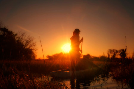 Fishermen rowing a boatの写真素材