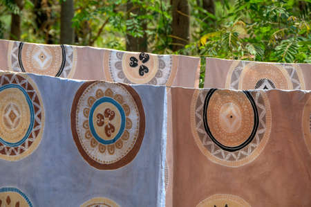 Fabrics with trational pattern on clotheslineの写真素材