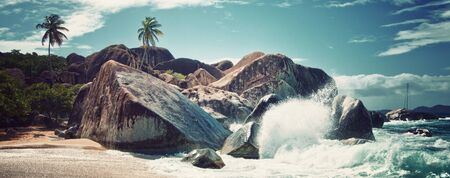 Water Splash on Big Granite Rocks at The Baths of Virgin Gorda Island in the Caribbean.の写真素材