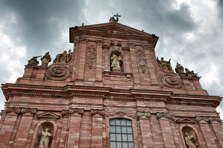 Low Angle View of Heidelberg University Library, Detail of Facade Architecture Looking Up at Red Brick Against Dark Grey Storm Clouds, Heidelberg, Baden-Wurttemberg, Germanyのeditorial素材
