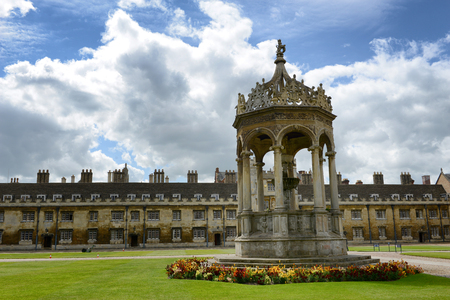 Historical stone fountain at Trinity College, Cambridge University, cambridge standing in the middle of neatly manicured green lawns in the Great Courtのeditorial素材