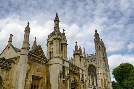 Low Angle View of Historical Kings College Clock Tower and Chapel Under Cloudy Sky, University of Cambridge, Englandのeditorial素材