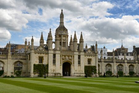 Kings College Gatehouse and Gothic Clock Tower as seen from Inside Courtyard with Manicured Green Lawn, University of Cambridge, Englandのeditorial素材