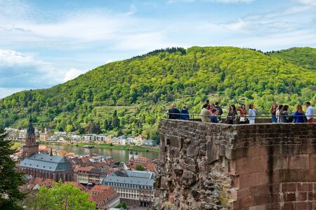 Overview of Town of Heidelberg on Banks of Neckar River Surrounded by Lush Green Hillsides, as seen from Tourist Observation Tower at Castle, Baden-Wurttemberg, Germanyのeditorial素材