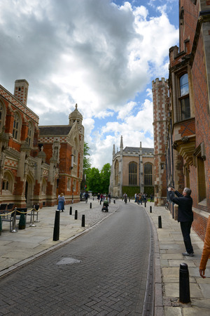 Street Scene of St Johns Street, Tourist Taking Photograph of St Johns Divinity School in front of Main Gate to St Johns College, University of Cambridge, Englandのeditorial素材