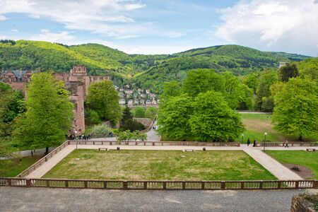 Overview of Castle Heidelberg and Fortress Grounds with View of Town Below Nestled in Lush Green Hillsides, Heidelberg, Baden-Wurttemberg, Germanyの写真素材