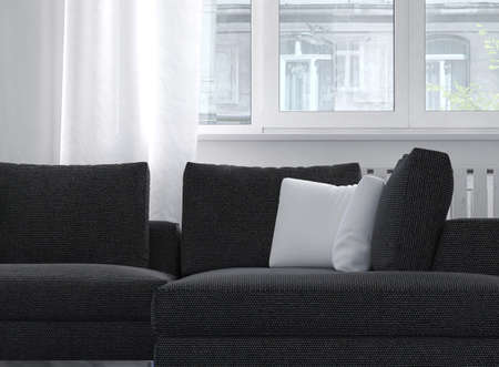 Close up of a charcoal colored comfortable classic upholstered sofa with cushions below a window with filmy white drapes. 3d Rendering.の写真素材