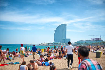 BARCELONA, SPAIN - MAY 02: Barceloneta Beach against W Barcelona Hotel in May 02, 2015 in Barcelona,...