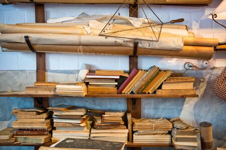 Antique Old Aged Books stacked on a wooden surface
