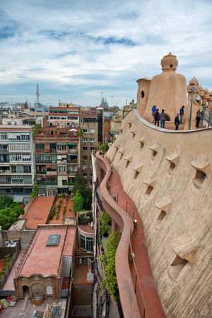 BARCELONA, SPAIN - MAY 01. Rooftop at Casa Mila (also known as La Pedrera) on May 1, 2015 in Barcelona. Terrace of the Casa Mila, with chimneys shaped anthropomorphic soldiers, created by Gaudiのeditorial素材