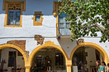 Architectural Detail of Yellow Building Archways in Sunny Plaza, Poble Espanyol Museum District,...