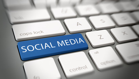 Online social media concept with a blue enter button on a white computer keyboard with the word -...