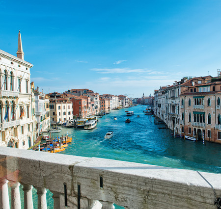 View of the Grand Canal, Venice, Italy looking over the stone balustrade of a balcony at the passing boat traffic and historic palaces belowのeditorial素材