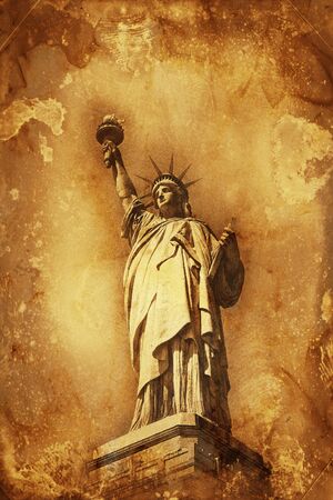Grunge colorful yellow and brown watercolor paint effect Statue of Liberty holding aloft the torch of Freedom with copy space for a travel or tourism themed conceptの写真素材