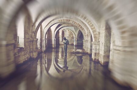 Winchester, Hampshire, UK - February 07, 2016: The flooded Crypt of Winchester Cathedral containing...