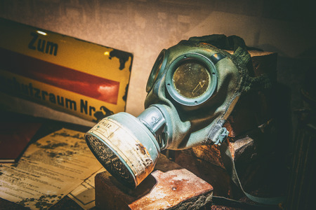 Augsburg, Germany - September 08, 2016: Textured aged view of an old WW1 gas mask on display in the museum in the Fuggerei museum, Augsburg, Germany with a heavy vignetteのeditorial素材