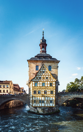 Old Rathaus or Town Hall on an island in the center of the River Regnitz, Bamberg, Bavaria, germany with its two arched stone bridges over the riverのeditorial素材