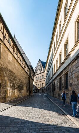 Narrow road near cathedral square in Bamberg, Germany with historic buildings
