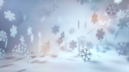 Festive cool toned Christmas snowflake background with falling snow in a wintry landscape and colorful sun flare i a wide angle banner formatの写真素材