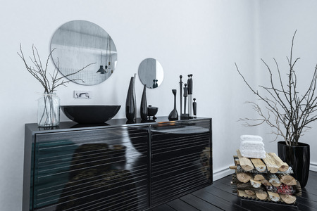 Modern black and grey bathroom interior with an elegant lacquered vanity cabinet and assorted ornaments, 3d renderの写真素材