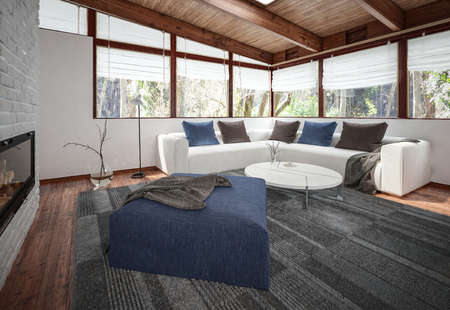 View of spacious living room with white sofa, floor carpet and blue pouf at fireplace and panoramic windows corner. 3d rendering.の写真素材