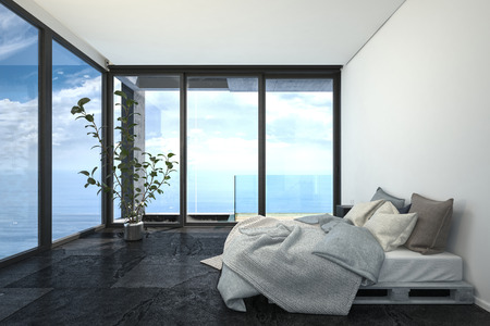 Hotel or penthouse bedroom in minimalist interior design, with bed on wooden trays, white walls, black floor and blue sea behind panoramic floor-to-ceiling windows. 3d rendering.の写真素材